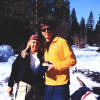 Michele and Johnny Mosley holding Olympic Gold Medal